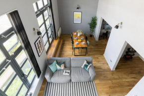 4B Loft Penthouse Industrial decor with canal & city views
